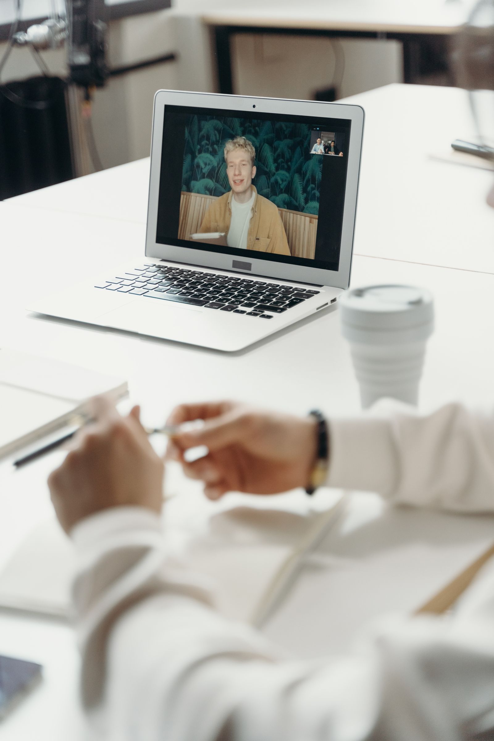 Laptop showing a video call during a remote meeting